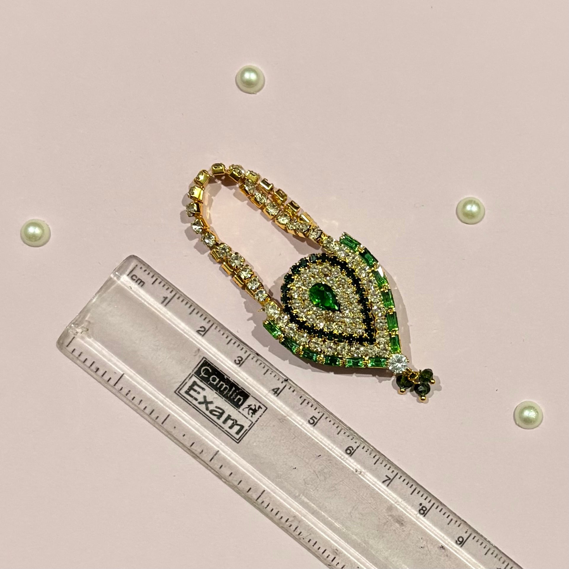 AD Drop Shaped Purse for deity shringar, a miniature stone-studded teardrop purse available in red, gold, dark blue, pink, sky blue and green