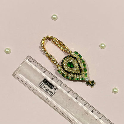 AD Drop Shaped Purse for deity shringar, a miniature stone-studded teardrop purse available in red, gold, dark blue, pink, sky blue and green
