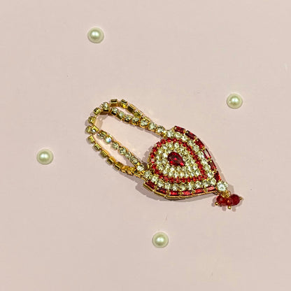 Red AD Drop Shaped Purse, a miniature gold-tone stone-studded teardrop purse to adorn deity idols like Radha Rani and Laddu Gopal