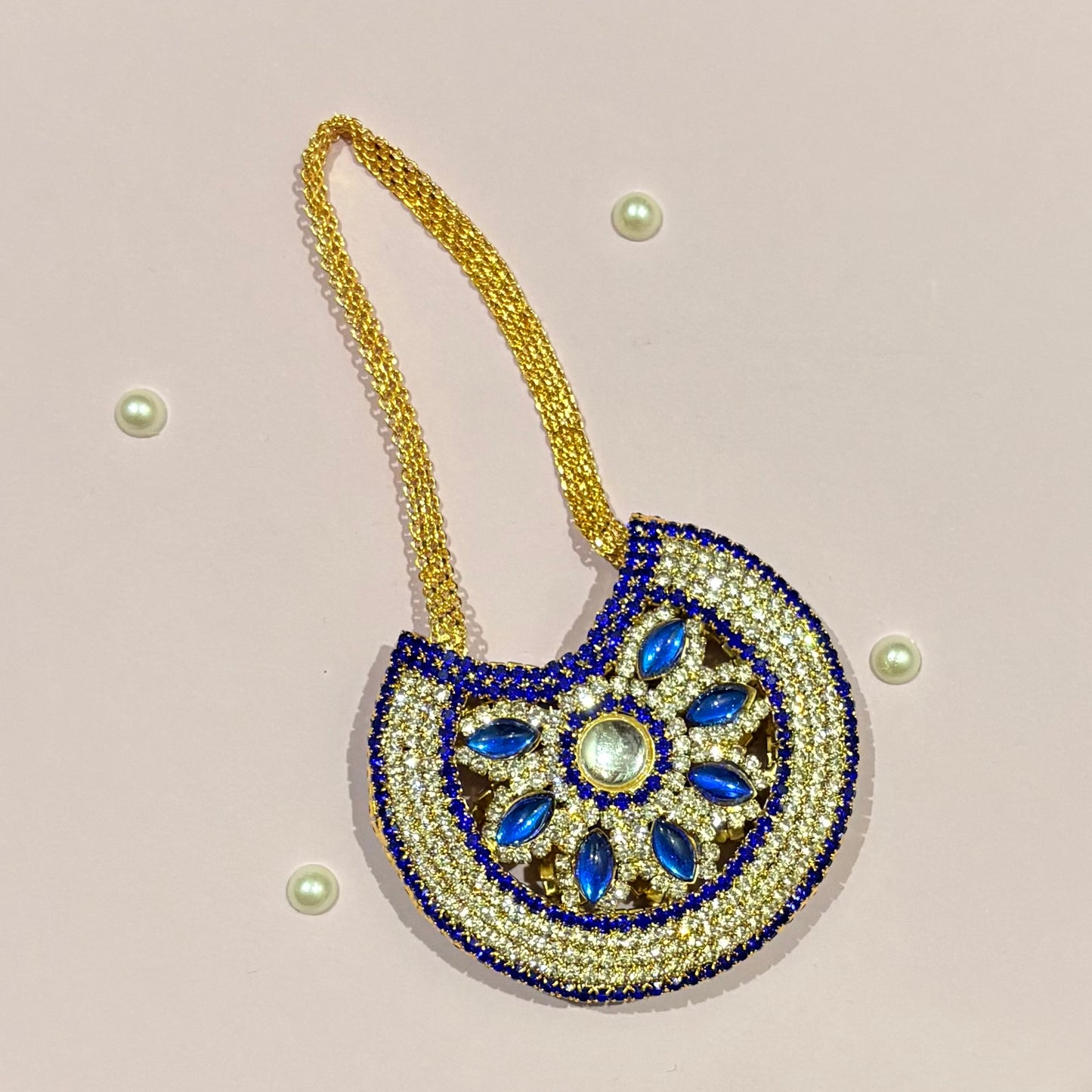 Dark blue AD Moon Shaped Purse (Big), a stone-studded crescent purse to decorate deity idols such as Thakur Ji and Radha Rani