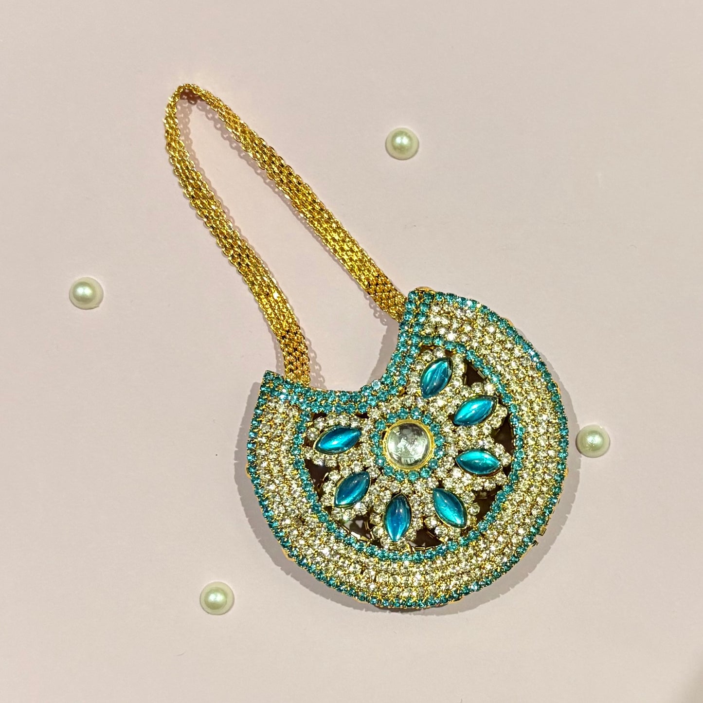 Sky blue AD Moon Shaped Purse (Big), a stone-studded crescent purse to adorn deity idols like Laddu Gopal and Radha Rani