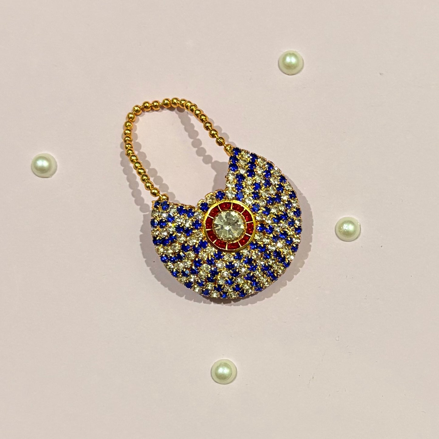 Dark blue AD Moon Shaped Purse, a small stone-studded crescent purse to decorate deity idols such as Thakur Ji and Radha Rani