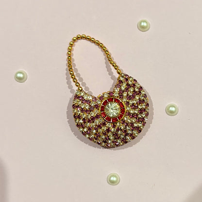 Pink AD Moon Shaped Purse, a small gold-tone American Diamond crescent purse for deity shringar and pooja decoration