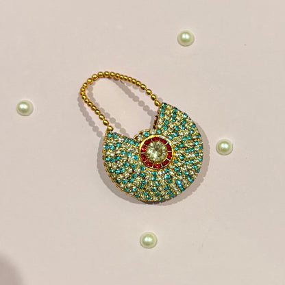 Sky blue AD Moon Shaped Purse, a small stone-studded crescent purse to adorn deity idols like Laddu Gopal and Radha Rani