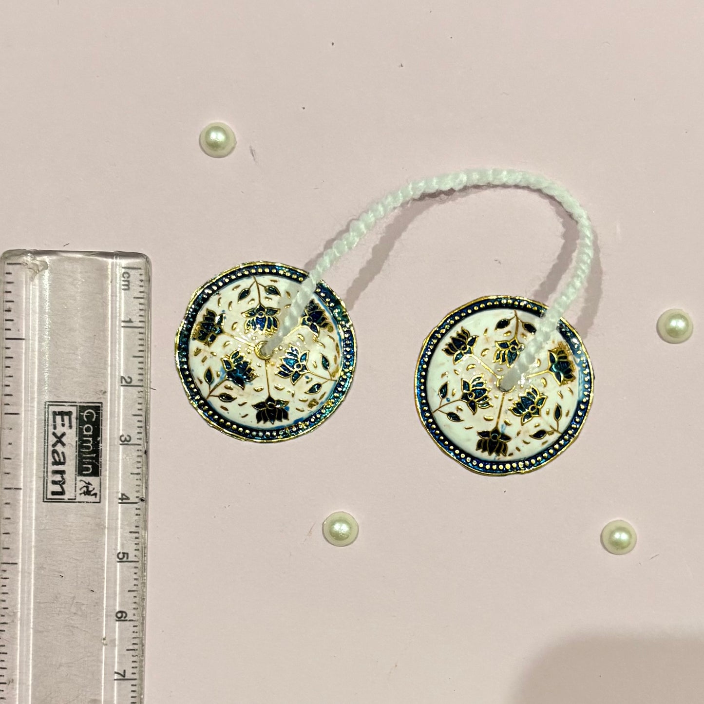 Close-up of miniature Majira (manjira) hand cymbals used in devotional music and deity pooja and seva