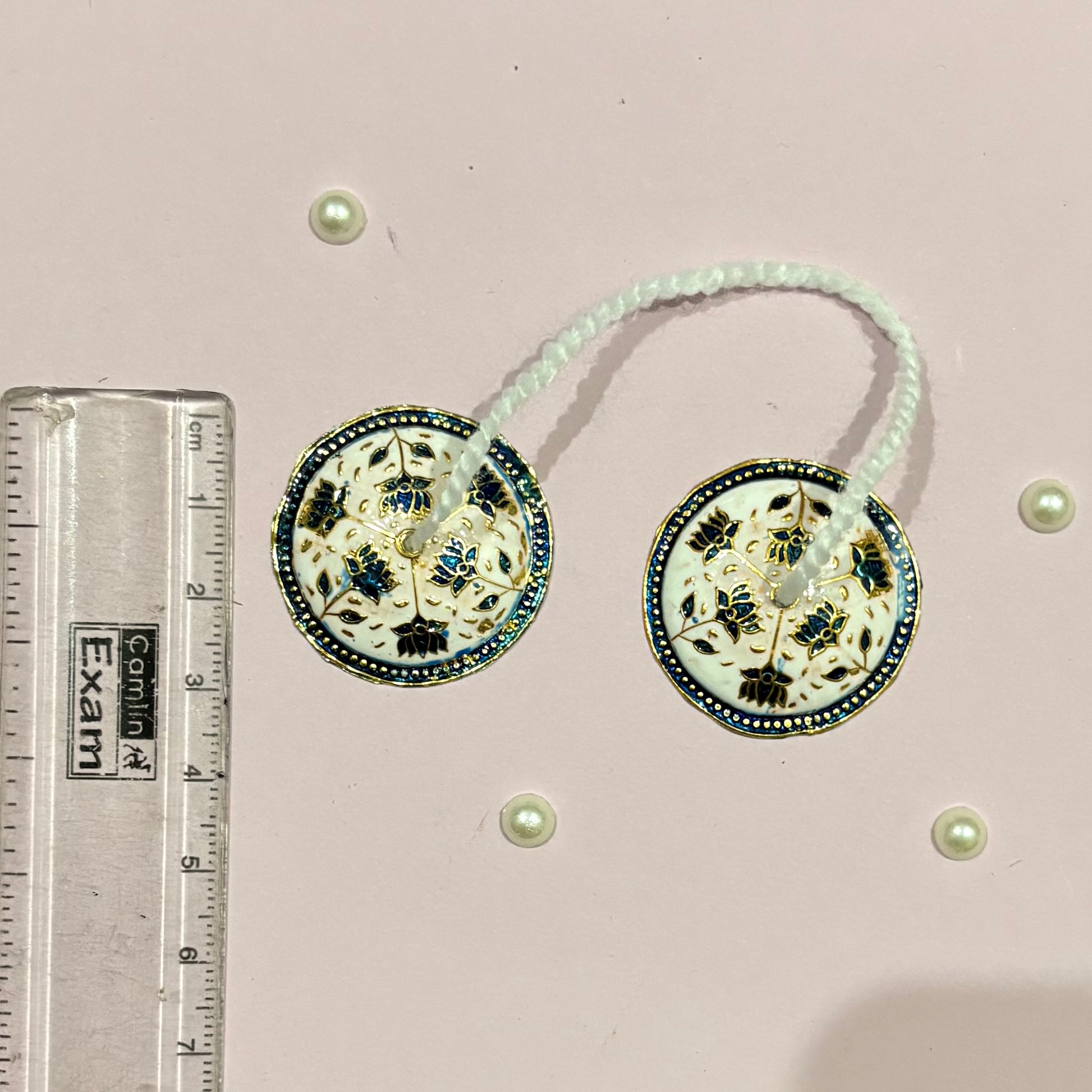 Close-up of miniature Majira (manjira) hand cymbals used in devotional music and deity pooja and seva