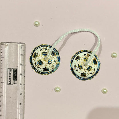 Close-up of miniature Majira (manjira) hand cymbals used in devotional music and deity pooja and seva