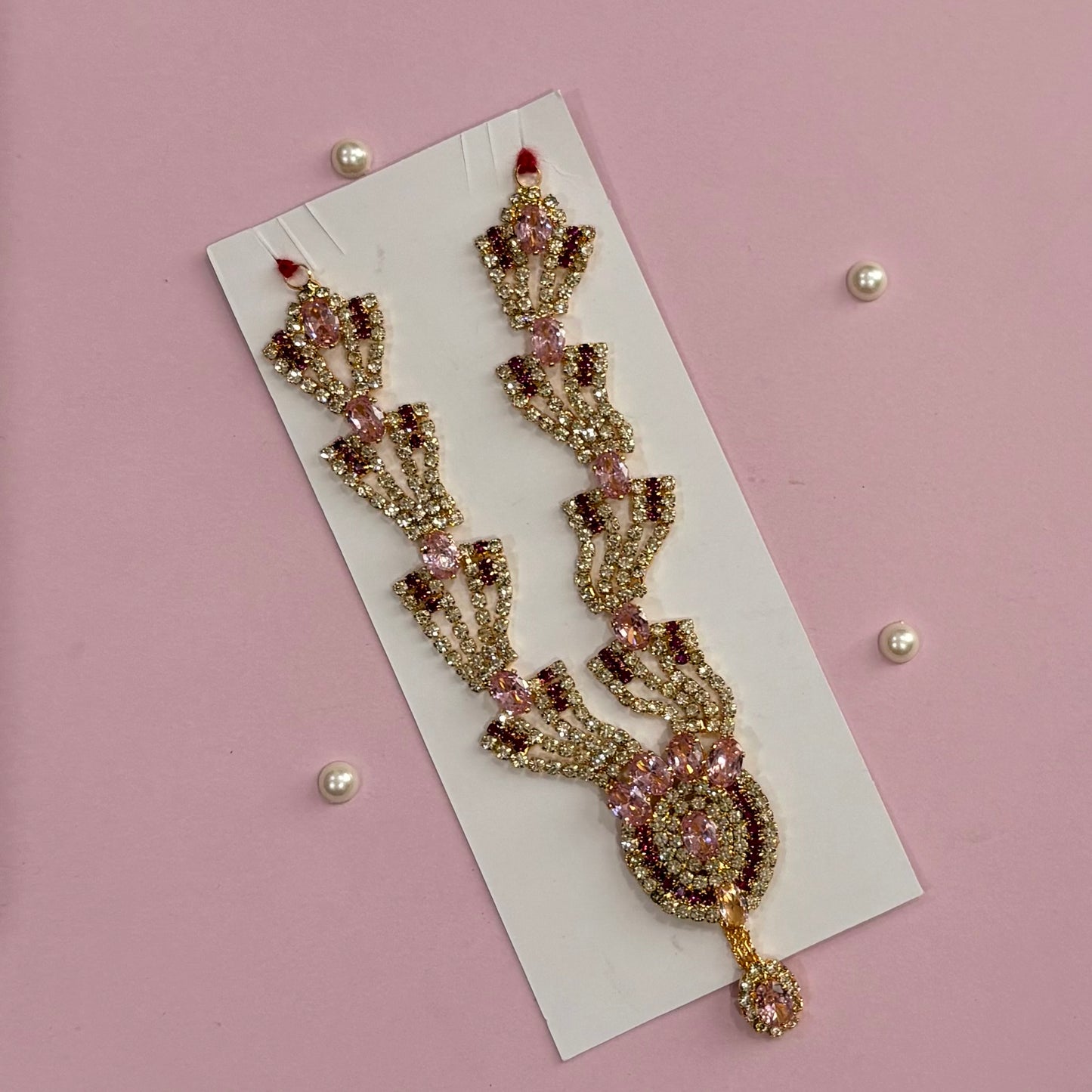 Pink Mala, a handcrafted gold-tone deity necklace to adorn idols like Radha Rani and Laddu Gopal for shringar and pooja decor