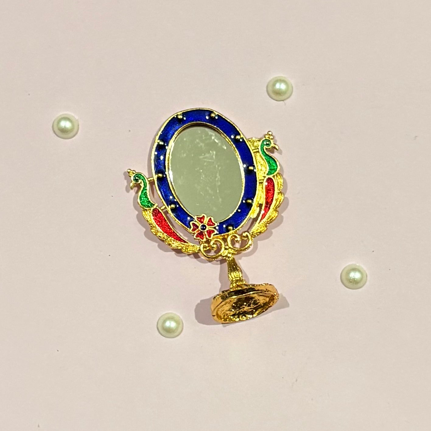 Miniature gold-tone metal Darpan (mirror) for deity seva, a handcrafted accessory to adorn idols like Radha Rani and Laddu Gopal