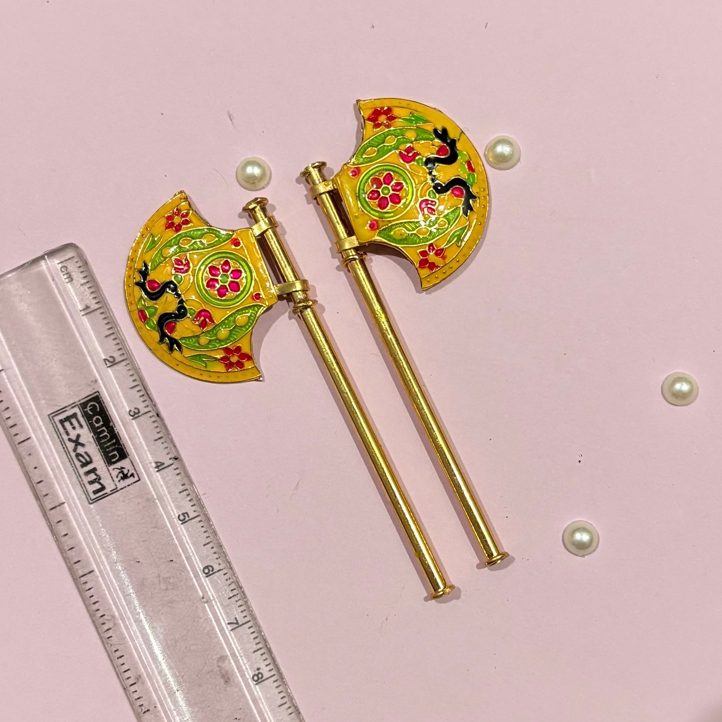 Close-up of the miniature Metal Pankhi hand fan used to adorn and fan deity idols during pooja, festivals and daily seva